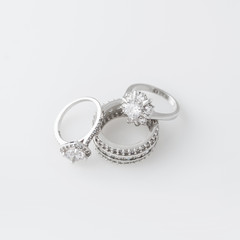 Luxury jewelry. White gold or silver rings with diamonds. Selective focus