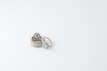 Luxury jewelry. White gold or silver rings with diamonds. Selective focus