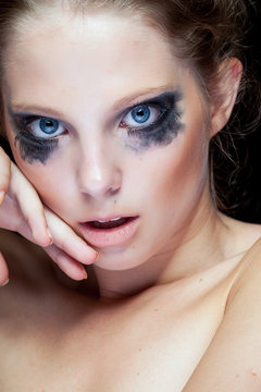 Gorgeous woman with black crying make up