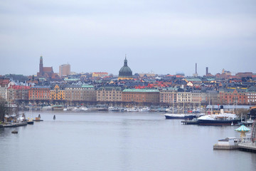 Fototapeta na wymiar Stockholm, Sweden - March, 16, 2016: panorama of Old Town of Stockholm, Sweden, with the boats on a sea