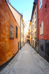 Obraz premium Stockholm, Sweden - March, 16, 2016: landscape with the image of Old Town street in Stockholm, Sweden