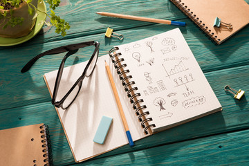 business concept - notepad with sketch on the desk