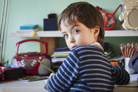 Boy doing homework at desk