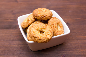 Cookies on a square bowl on wooden table