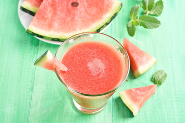 Watermelon juice in glass and slices