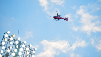 flying helicopter over fotball spotlights turned at sunset © tutye