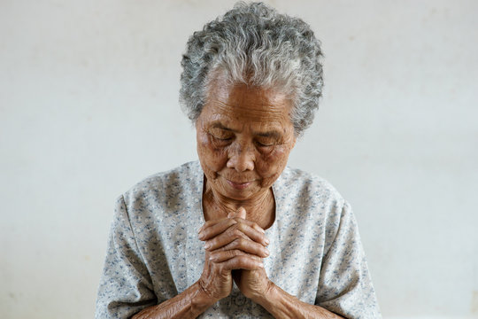 Pray of senior asian woman