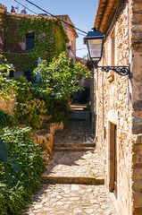 Sunny street in fortress Tossa de Mar, Girona province, Spain.