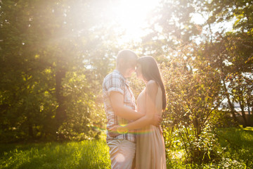 Teen couple lovely hugging on nature and have fun in park. Happy couple.