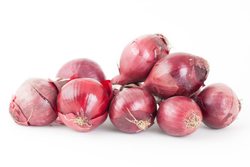 Bunch of red onions on white background