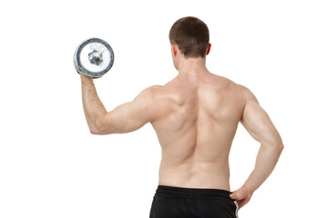 Fototapeta na wymiar Muscular young man exercising with dumbbell.