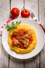 cod with tomato sauce and porridge