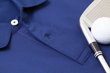 Blue polo shirt and golf equipments