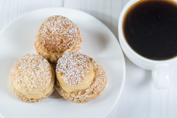 Top view of shu pastries with coffee
