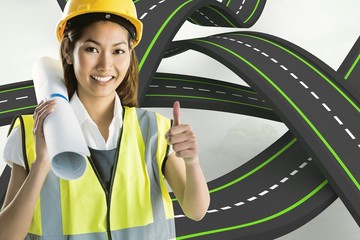 Composite image of architect woman with thumbs up