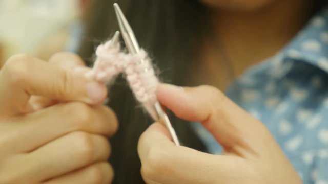 4K : Close up of Asian girl practice to knitting