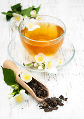 Cup of tea with jasmine flowers