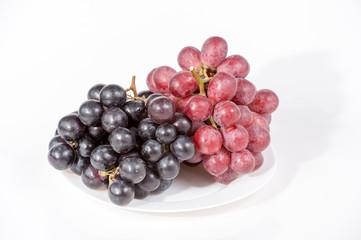 grape on white plate isolated on white background