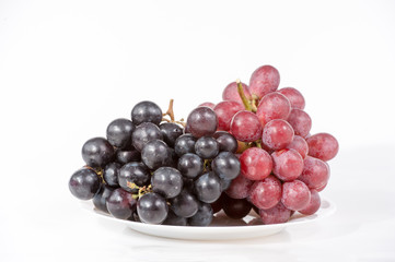 grape on white plate isolated on white background