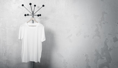 Photo of blank white sweatshirt hanging on the hanger. Empty concrete wall background. Space for your business information. Wide mockup