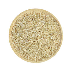 Brown rice in wooden bowl on white background