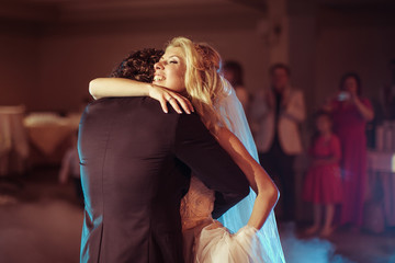 Romantic elegant newlywed couple dancing at wedding reception, s