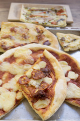 wedge of homemade pizza with spicy salami