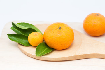 small orange or kumquat, mini size fruit.