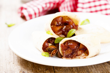 Pancakes with fruit and wine filling