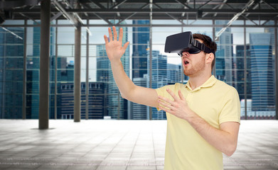 happy man in virtual reality headset or 3d glasses