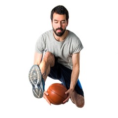 Man playing basketball jumping