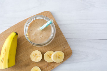 Banana smoothie on wood
 