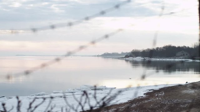 The view from behind barbed wire on the sea cost