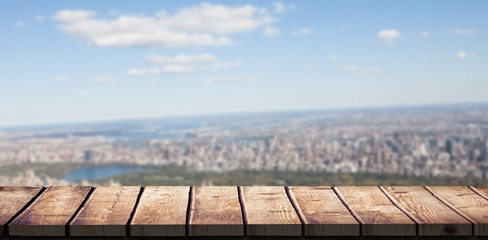 Composite image of wooden desk