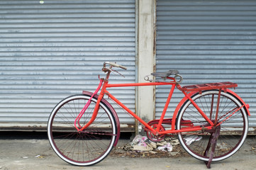 Fototapeta na wymiar colorful classic bicycle with grunge background.