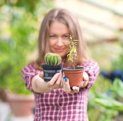 smiling woman in greenhouse