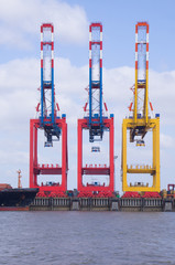 three loading cranes at the deep sea port of bremerhaven
