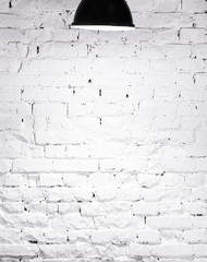 Fototapeta premium texture of brick whitewashed wall with lamp on top