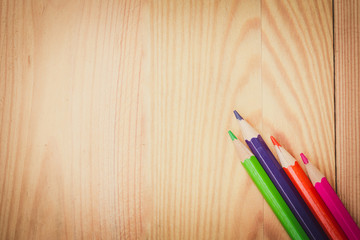 Obraz premium color pencils on wood table background vintage color tone, artist school concept.
