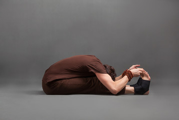 beautiful man doing yoga