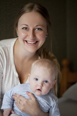 Mother and her little son at home