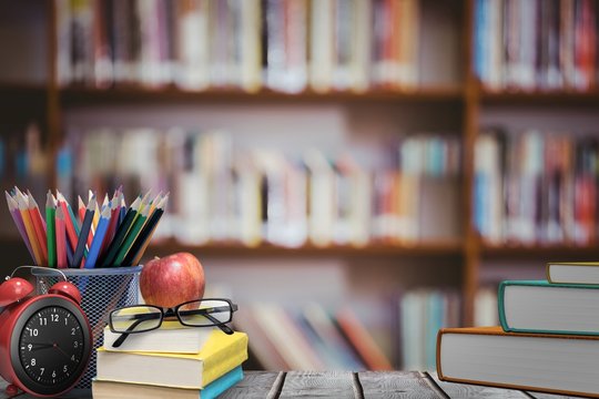 Composite image of school supplies on desk