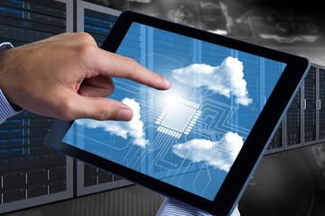 Composite image of man using tablet pc 