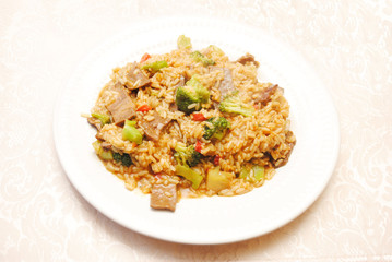 Rice with Beef & Broccoli Served on a White Plate
