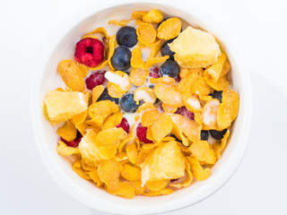 blueberry and milk on the white dish