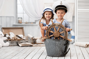 Children playing in the sailors in his room - obrazy, fototapety, plakaty
