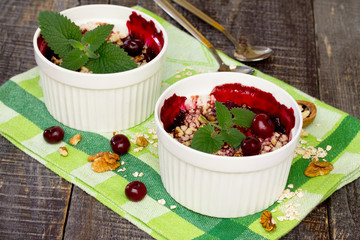 Homemade cherry crumble dessert in a rustic style.