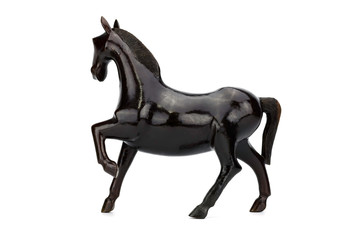 Beautiful sculpture of horse made of  wood isolated on the white