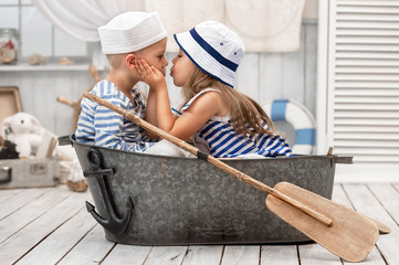 Children playing in the sailors in his room