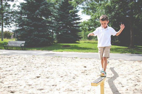 Child Playing On The Park Play Structure Balance Beam